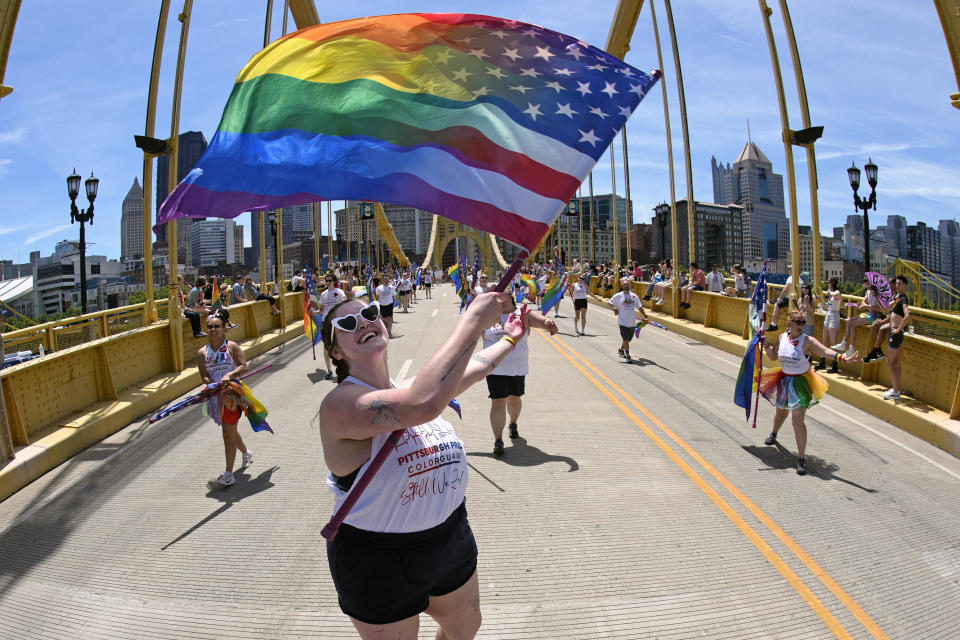 The Pittsburgh Pride Parade 2024 makes its way across the Andy Warhol Bridge in downtown Pittsburgh, Saturday, June 1, 2024. (AP Photo/Gene J. Puskar)