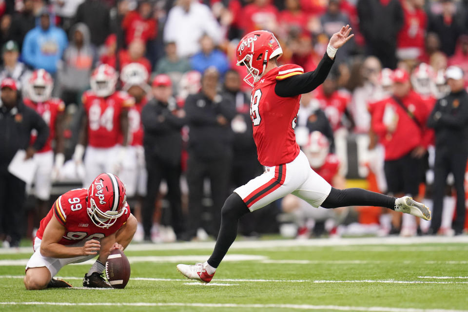 Maryland place kicker Chad Ryland, right, with Colton Spangler holding, kicks a field goal against Michigan State during the second half of an NCAA college football game, Saturday, Oct. 1, 2022, in College Park, Md. (AP Photo/Julio Cortez)