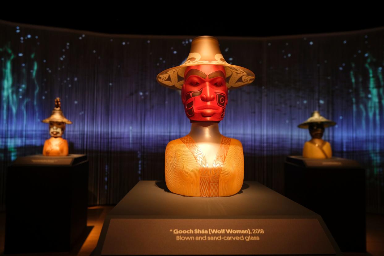 Tlingit artist Preston Singletary's 2018 blow and sand-carved glass sculpture "Gooch Shaa (Wolf Woman)" is on view in the exhibit "Preston Singletary: Raven and the Box of Daylight" Thursday, Nov. 9, 2023 at the Oklahoma City Museum of Art. The multi-sensory experience combines glass, video, and audio to tell the story of Raven, a creator figure in Tlingit culture.