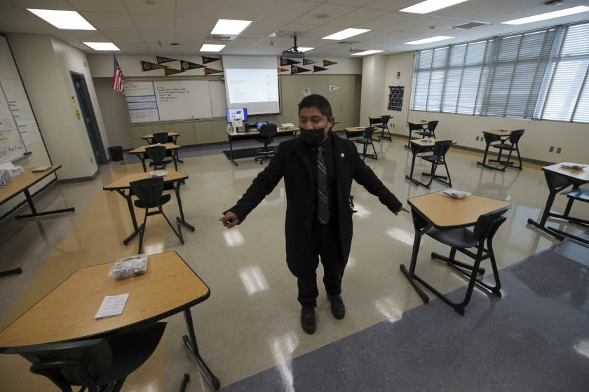 Panorama City, CA - March 10: English teacher Elmer Garcia describes when schools will reopen seats in a classroom will set at least 6-feet apart at Panorama High School on Wednesday, March 10, 2021 in Panorama City, CA.(Irfan Khan / Los Angeles Times)