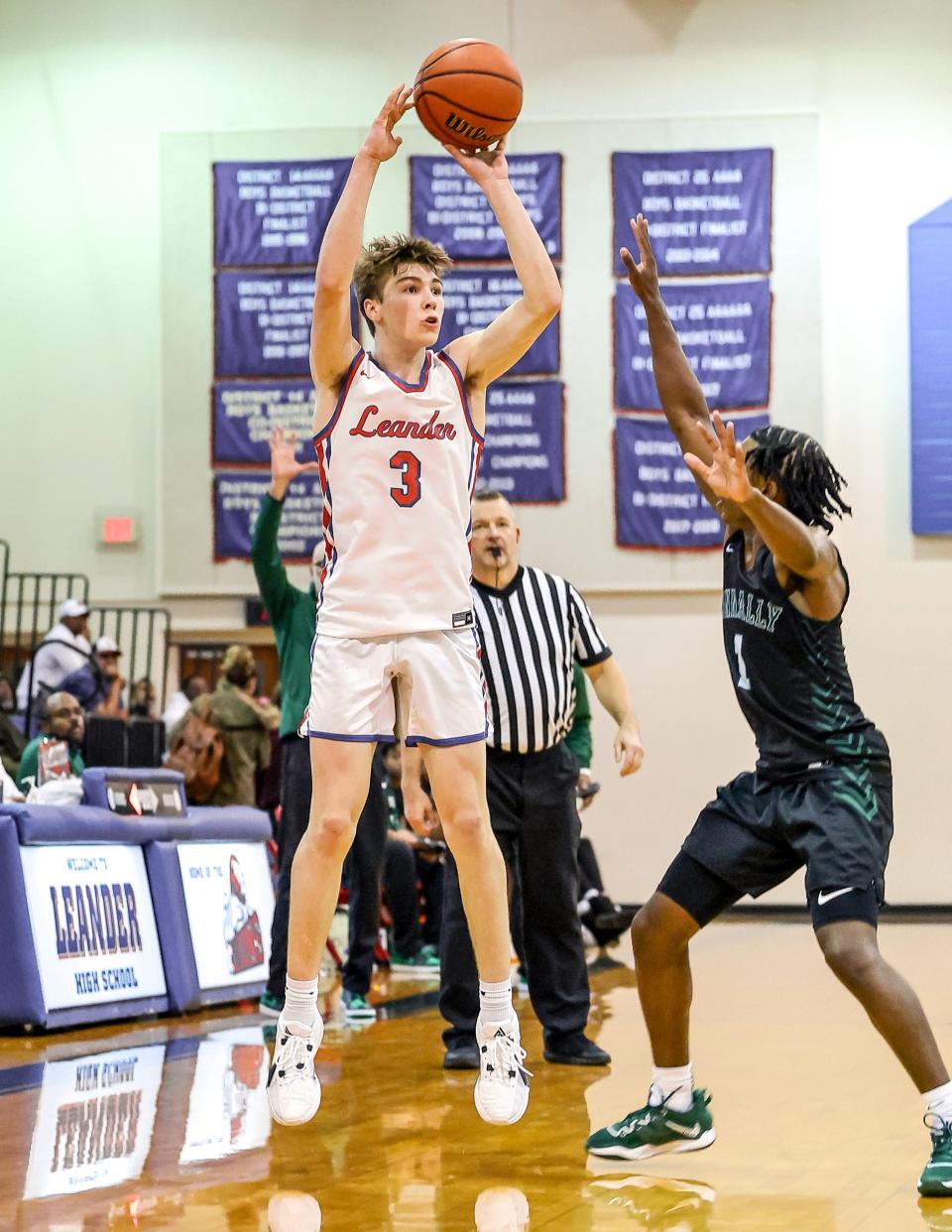 Ryder Bradley (3) shoots a late three for Leander over Jordan Wright to draw within three points against Connally in a non-district matchup Nov. 28, 2023, at Leander High. Visiting Connally held on to top Leander, 37-32, in a defensive battle.
