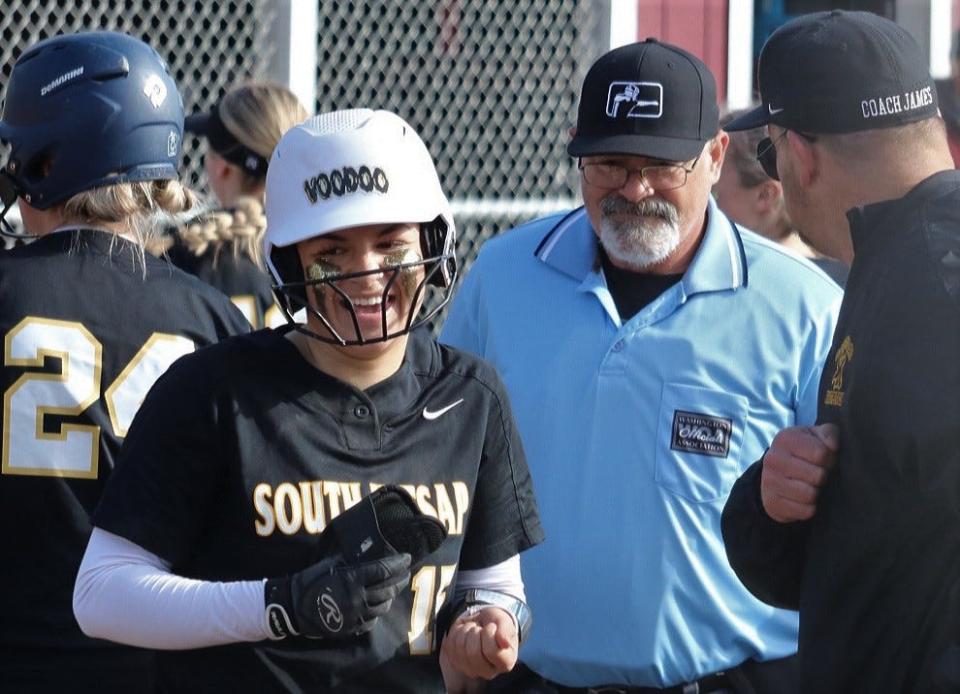 South Kitsap's Sarah Hoyt smiles after reaching home plate following her home run against Curtis on Friday.