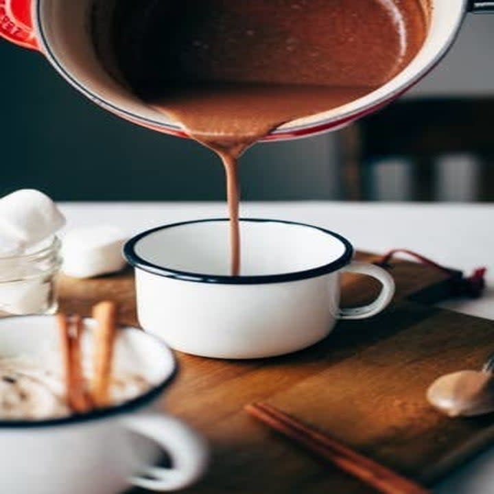 Tahini Hot Chocolate being poured into a cup