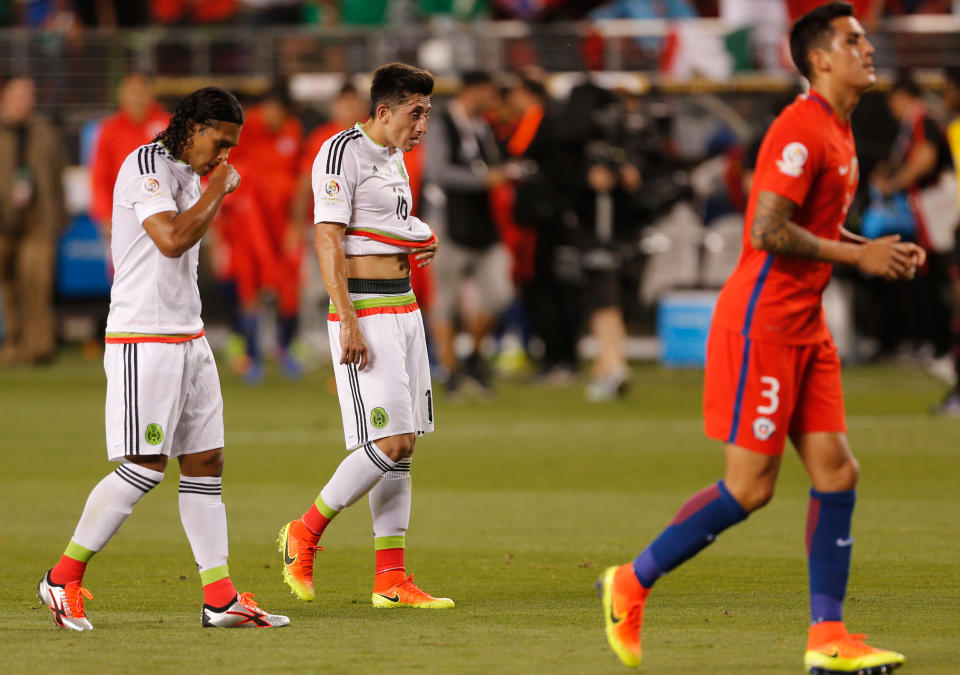 Mexican players (L) react in dejection after a Copa America Centenario quarterfinal football match against Chile in Santa Clara, California, United States, on June 18, 2016.  Chile defeated Mexico by 7-0 and qualified for semi-finals. / AFP / Beck Diefenbach        (Photo credit should read BECK DIEFENBACH/AFP/Getty Images)