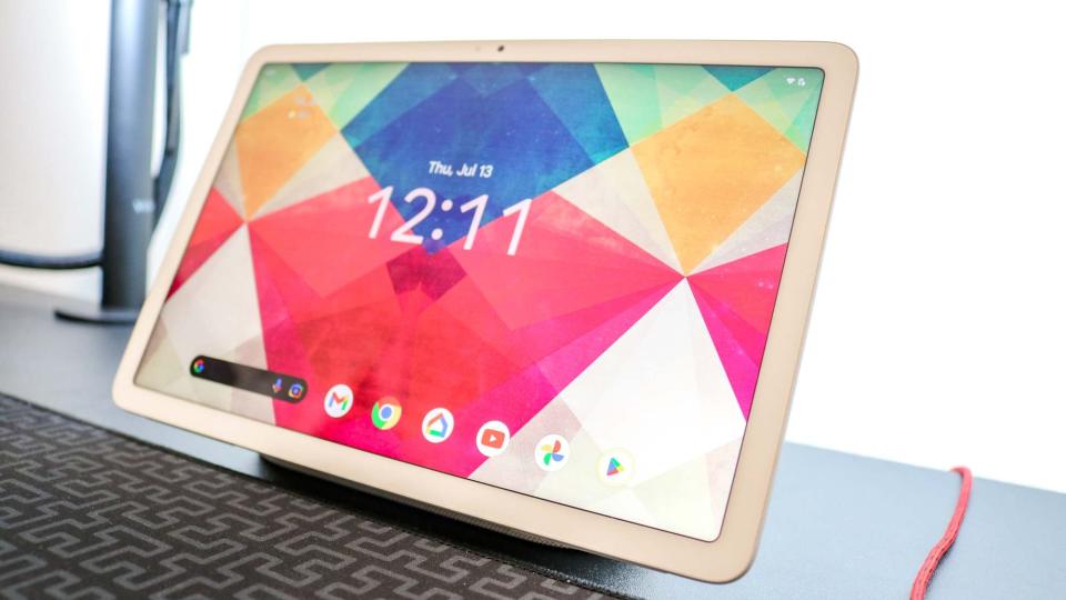 The Google Pixel Tablet on a desk underneath a monitor