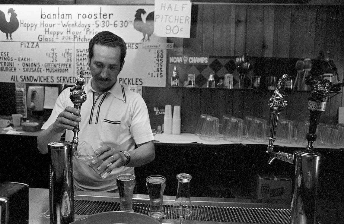 Lynwood R. Toney, proprietor of Bantam Rooster Tavern, is seen pulling pints of Schlitz in 1974. Note the 90 cents price for a half pitcher.
