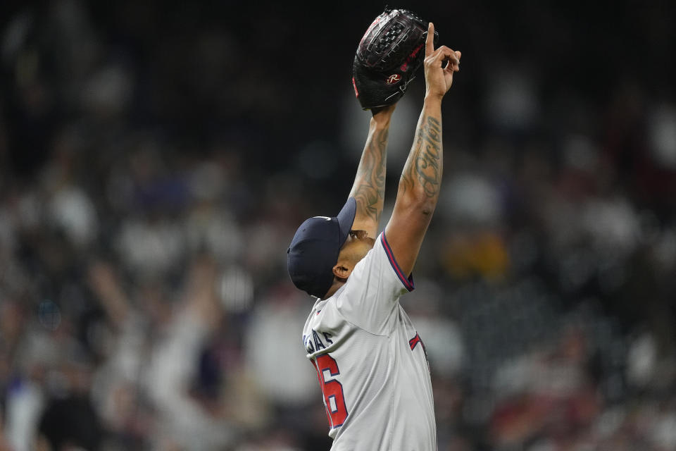 Atlanta Braves pitcher Raisel Iglesias gestures after retiring Colorado Rockies' Elias Díaz for the final out of a baseball game Saturday, Aug. 10, 2024, in Denver. (AP Photo/David Zalubowski)