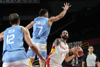 Spain's Ricky Rubio, right, shoots in front of Argentina's Facundo Campazzo (7) during a men's basketball preliminary round game at the 2020 Summer Olympics, Thursday, July 29, 2021, in Saitama, Japan. (AP Photo/Eric Gay)