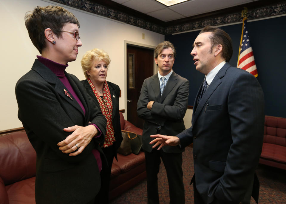 From left, Nevada Assemblywoman Heidi Swank, D-Las Vegas, Las Vegas Mayor Carolyn Goodman, Michael Nilon and actor Nicholas Cage talk at the Legislative Building Carson City, Nev., on Tuesday, May 7, 2013. Goodman, Nilon and Cage testified in support of a measure that would offer tax incentives to filmmakers in an effort to bring jobs and revenue to the state. (AP Photo/Cathleen Allison)