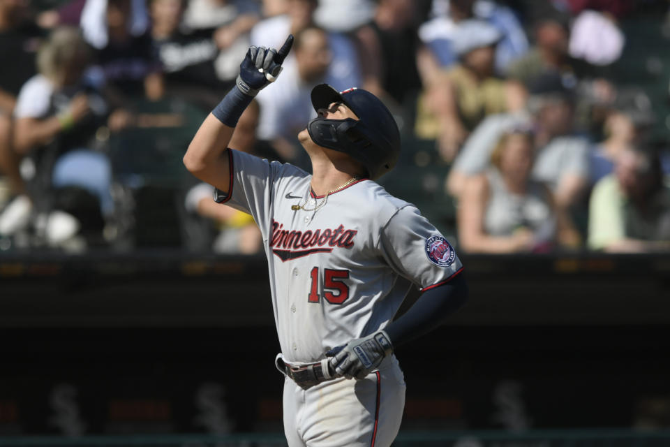 Minnesota Twins' Gio Urshela celebrates at home plate after hitting a two-run home run against the Chicago White Sox during the eighth inning of a baseball game Wednesday, July 6, 2022, in Chicago. Chicago won 9-8 in 10 innings. (AP Photo/Paul Beaty)