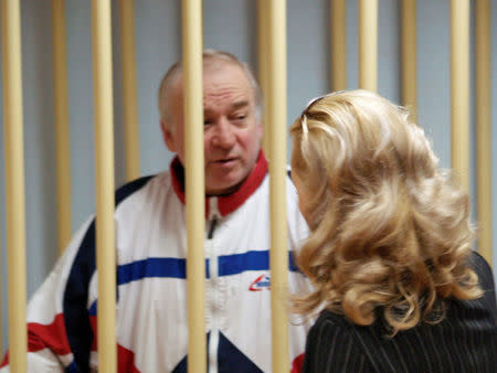 FILE PHOTO: Sergei Skripal, a former colonel of Russia's GRU military intelligence service, looks on inside the defendants' cage as he attends a hearing at the Moscow military district court, Russia August 9, 2006. Kommersant/Yuri Senatorov via REUTERS