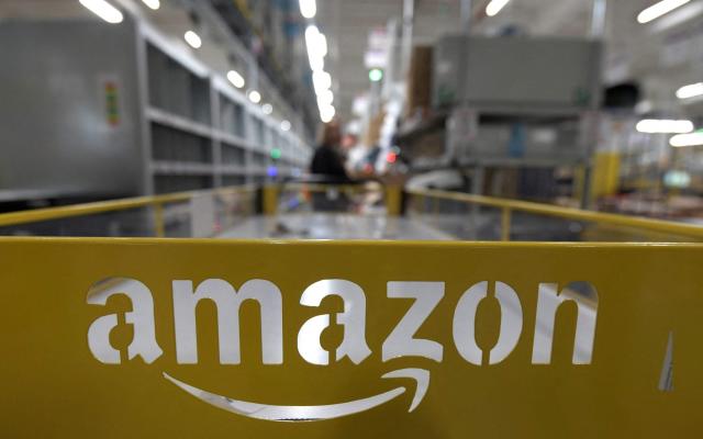 Amazon has increased its starting pay rates - INA FASSBENDER/AFP via Getty Images