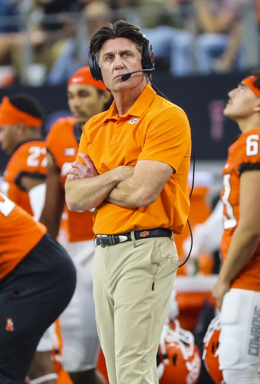 Dec 4, 2021; Arlington, TX, USA; Oklahoma State Cowboys head coach Mike Gundy reacts against the Baylor Bears during the first half of the Big 12 Conference championship game at AT&T Stadium. Mandatory Credit: Kevin Jairaj-USA TODAY Sports