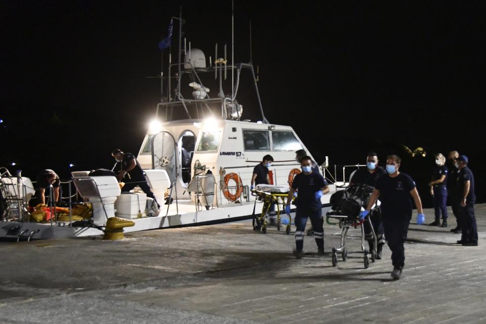 A coast guard vessel arrives with two bodies at Pythagorio port, on the eastern Aegean island of Samos, Greece, late Monday, Sept. 13, 2021. Authorities in Greece Tuesday opened an investigation into the crash of a private plane from Israel that killed a prosecution witness in the corruption trial of former Israeli prime minister Benjamin Netanyahu. Haim Geron, a former senior official at Israel's ministry of communications, and his wife Esther were killed in the crash late Monday off the island of Samos. (AP Photo/Michael Svarnias)