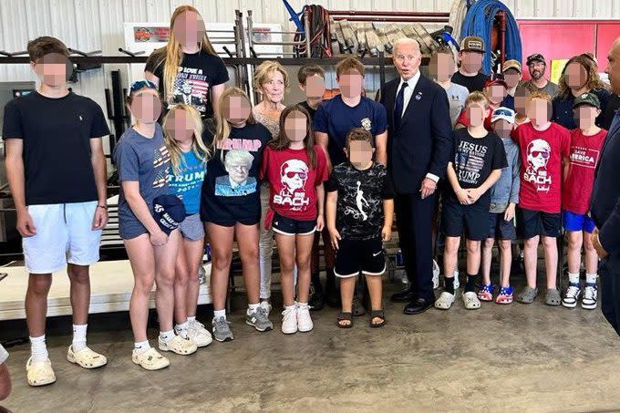 President Joe Bden posed for a picture with several kids wearing Donald Trump gear during his visit to Shanksville, Pa. on Sept. 11, 2024.