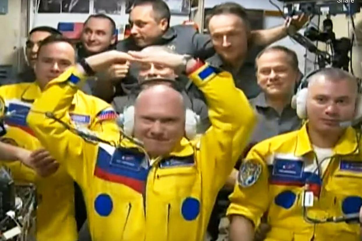 From video footage released by the Roscosmos Space Agency, newly arrived to the ISS, wearing yellow suits, Russian cosmonauts leg rtemiev, center, Denis atveev, right, and Sergei Korsakov pose among other participants of expedition to the International Space Station, ISS, after docking the Soyuz MS-21 spaceship to the station International Space Station - 18 Mar 2022