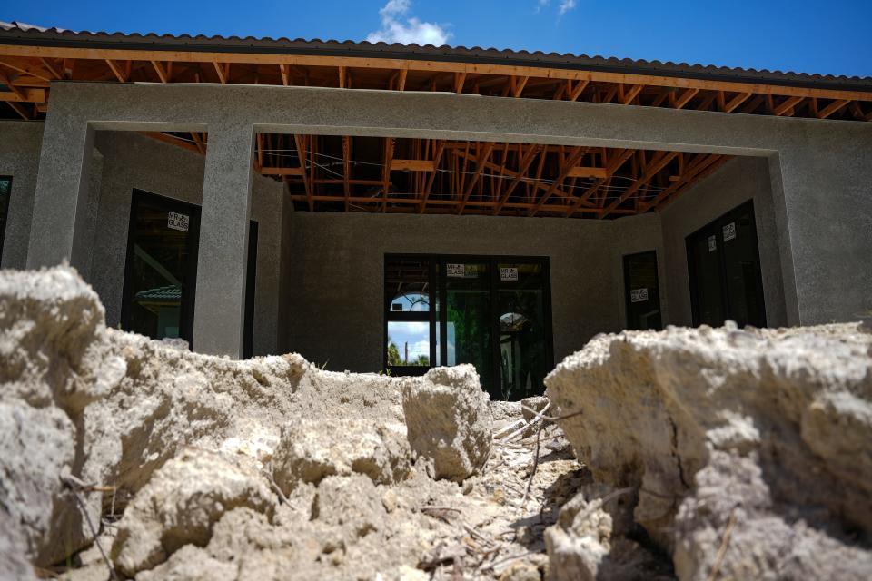 Erosion from rainfall leads to the foundation at a Metro Home Builders construction site in Naples on Tuesday, Aug. 15, 2023.