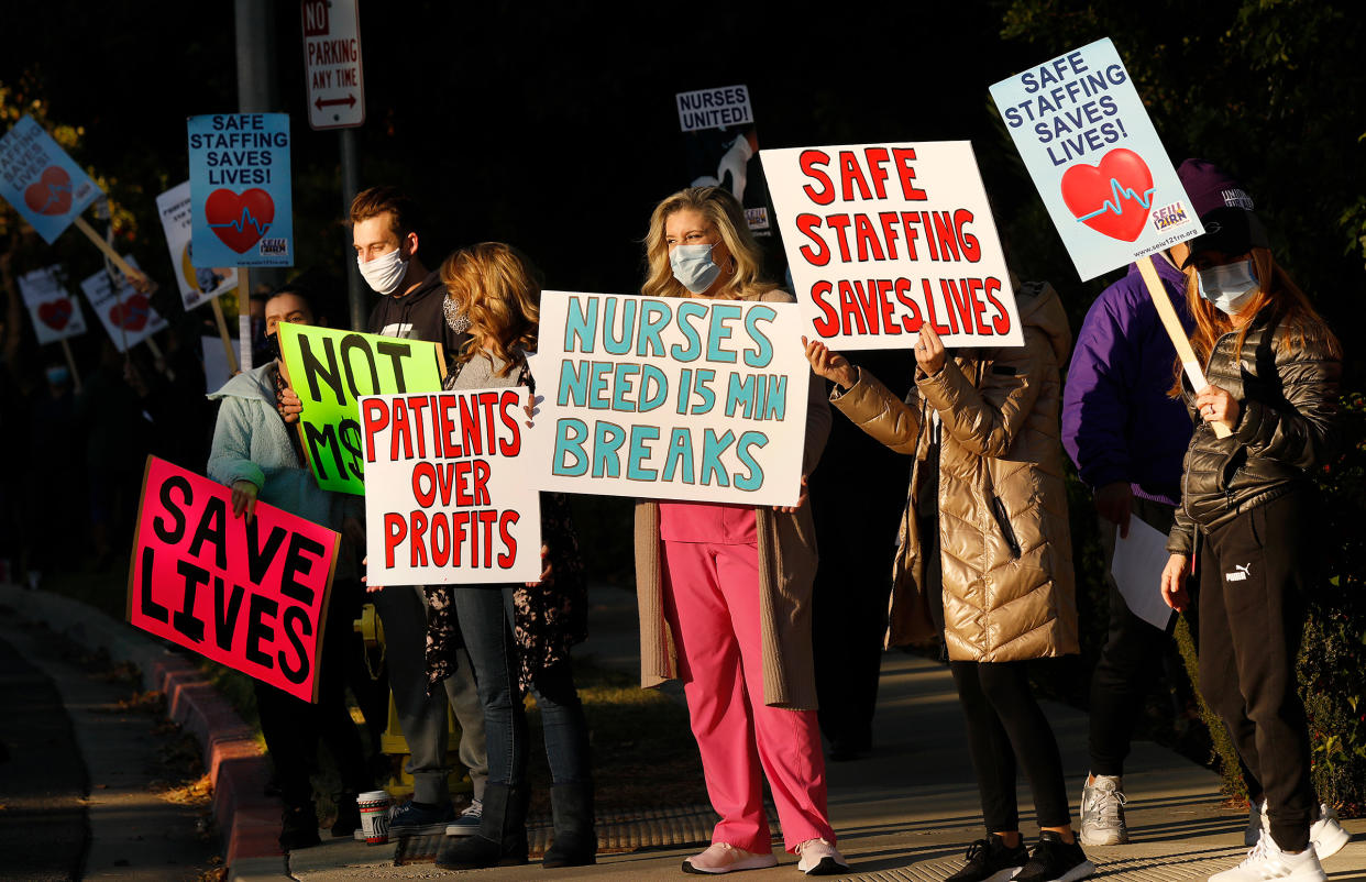 Nurses and licensed medical professionals picket in front of Los Robles Regional Medical Center to raise concerns over lack of COVID-19 testing for patients and staff, continued insufficient PPE and dangerous lack of staff on duty, in Thousand Oaks, Calif., on Nov. 30, 2020.