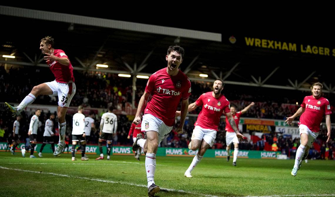 Wrexham’s Tom O’Connor celebrates scoring against Sheffield United during the English FA Cup fourth round soccer match at The Racecourse Ground, Wrexham, Wales, Sunday Jan. 29, 2023. Peter Byrne/AP