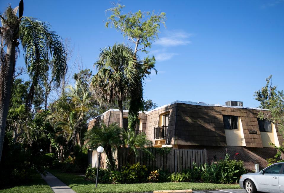 The roofs of the Parkwoods Condominiums are covered with white tarps on Friday, June 2, 2023, after being damaged in Hurricane Ian last September. Residents are waiting for repairs to begin.