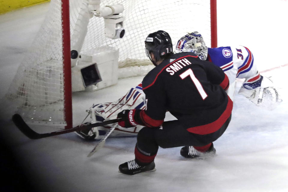 Carolina Hurricanes defenseman Brendan Smith (7) puts the puck past New York Rangers goaltender Igor Shesterkin (31) for a goal during the second period during Game 2 of an NHL hockey Stanley Cup second-round playoff series Friday, May 20, 2022, in Raleigh, N.C. (AP Photo/Chris Seward)