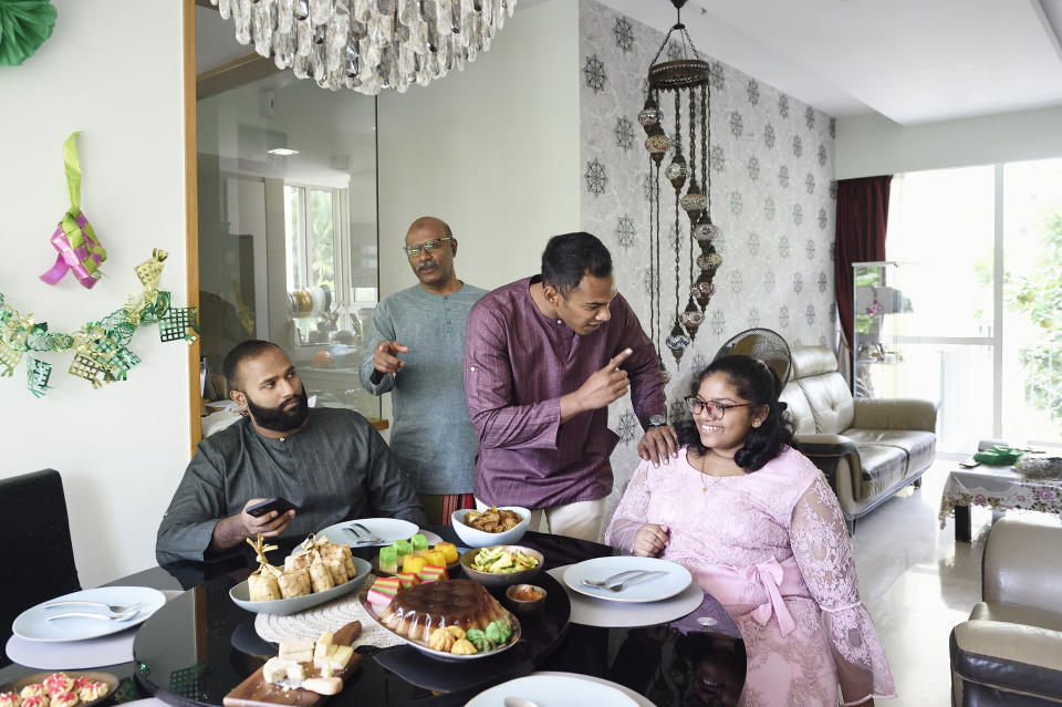 A family enjoys a meal together at a dining table