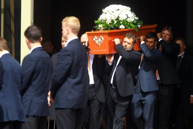 Pallbearers including actor Russell Crowe (centre R) carry the casket of former New Zealand cricketer Martin Crowe during his funeral at the Holy Trinity Cathedral in Auckland on March 11, 2016