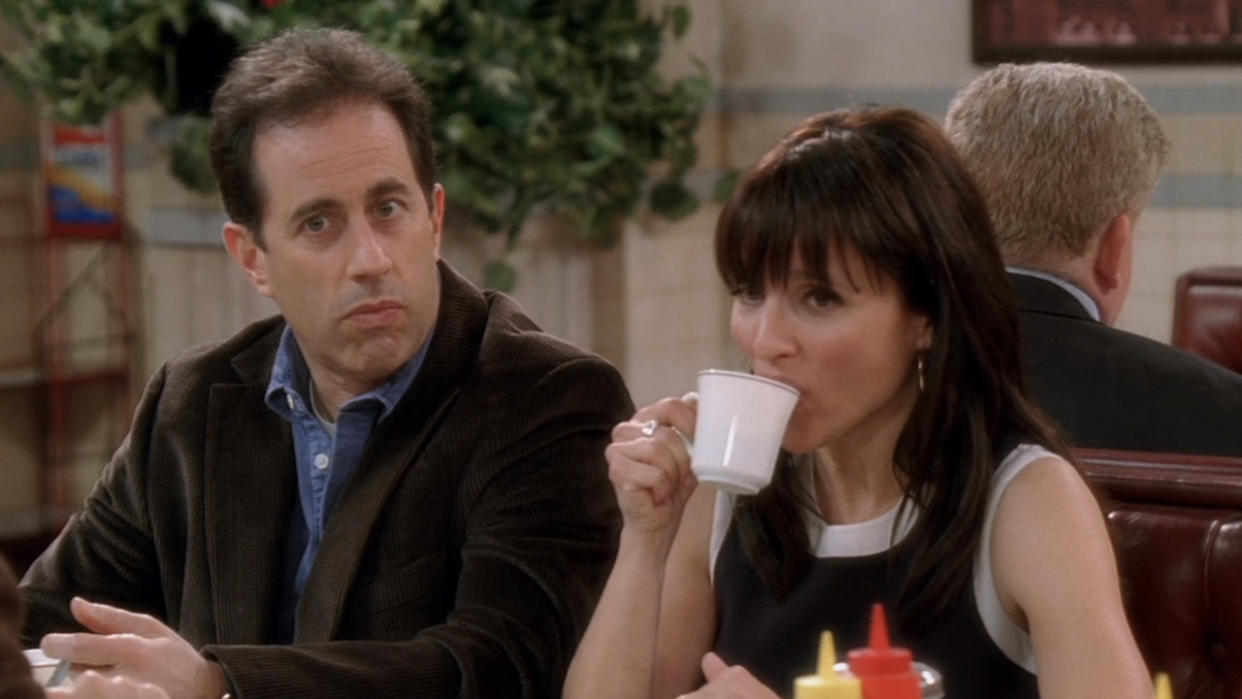  Jerry sitting next to Elaine, drinking a cup of coffee, at Monk's Diner in the Seinfeld reunion finale of Curb Your Enthusiasm. 