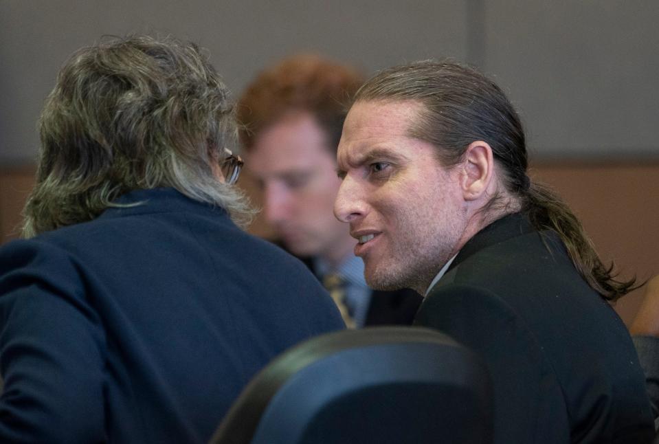 Jonathan Schuler talks to Public Defender Carey Haughwout during sentencing in the Palm Beach County Courthouse in West Palm Beach, Florida on May 4, 2021.