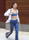 <p>In blue pants and a blue sports bra, white jacket and Jennifer Fisher earrings while out in NYC.</p>