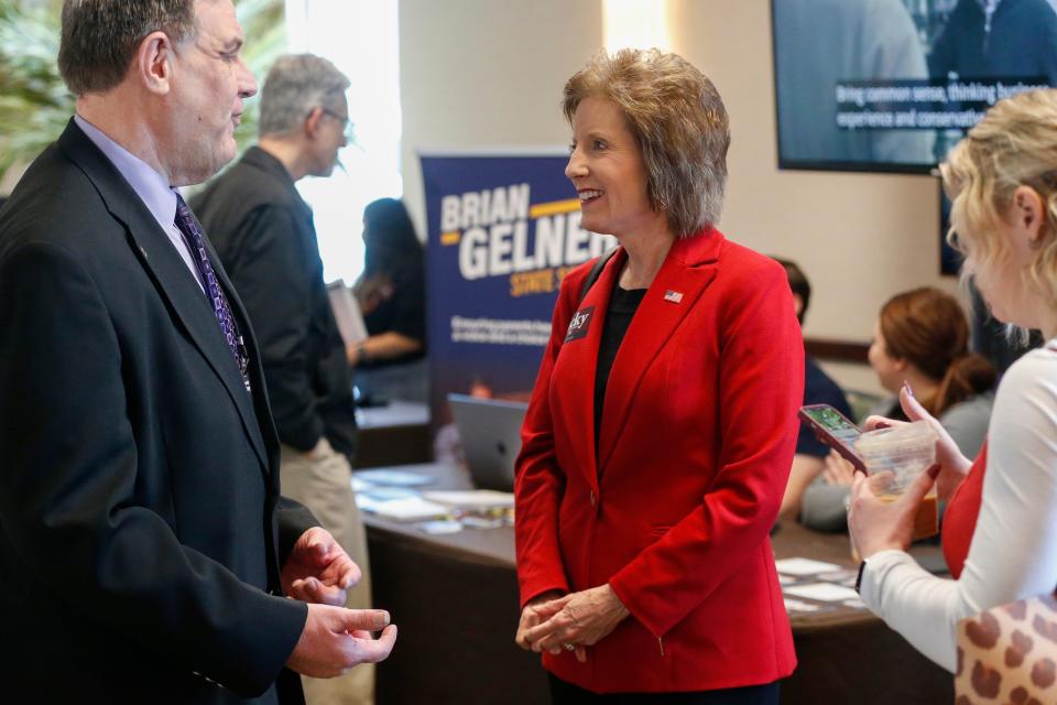 U.S. Rep. Vicky Hartzler, right, a Republican Senate candidate, talks with voters during the Greene County Lincoln Day event at the Oasis Convention Center on Saturday, March 5, 2022.