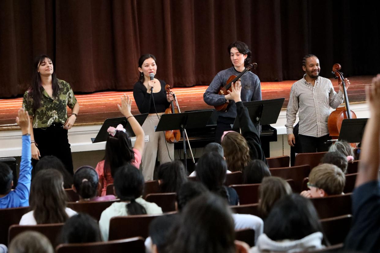 Flutist Anjali Shinde, left, violinist Isabelle Durrenberger, violist Isabella Bignasca and cellist Thapelo Masita, with Ensemble Connect, lead an interactive performance for fourth- and fifth-grade orchestra students at Washington Irving Intermediate School in Tarrytown April 11, 2024. The performance was sponsored by The Pocantico Center during Ensemble Connect's residency at Pocantico.