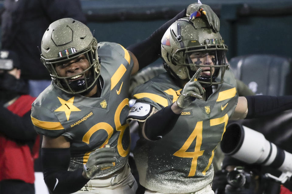 Army defensive back Noah Short (47) celebrates blocking a punt return by Navy punter Riley Riethman for a touchdown in the second quarter of an NCAA college football game in Philadelphia, Saturday, Dec. 10, 2022. At left is fellow defensive back Donavon Platt. (Heather Khalifa/The Philadelphia Inquirer via AP)