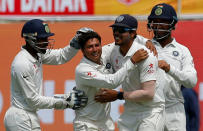 Cricket - India v Australia - Fourth Test cricket match - Himachal Pradesh Cricket Association Stadium, Dharamsala, India - 25/03/17 - India's Kuldeep Yadav celebrates the dismissal of Australia's Glenn Maxwell with his teammates. REUTERS/Adnan Abidi