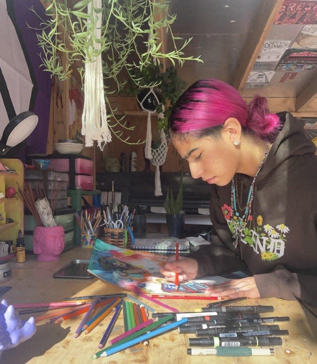 Silverado High School graduate Avery Rodriguez, 18, works at her home art studio in Victorville. Rodriguez was recently honored for a rare perfect score on the AP Drawing Exam.