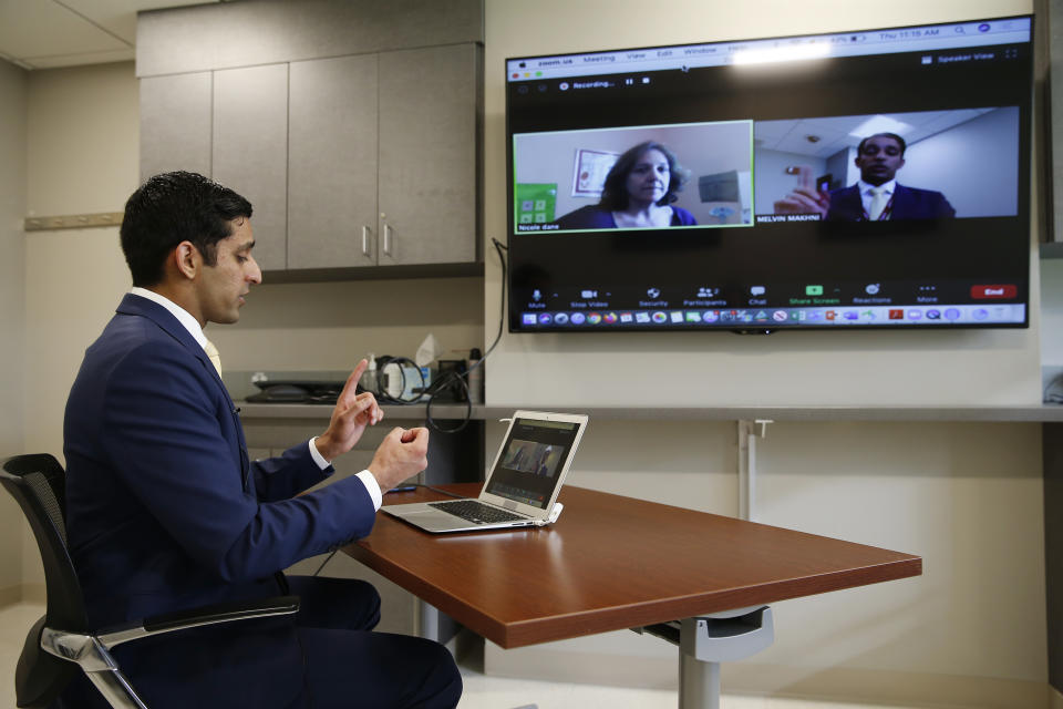 BOSTON, MA - MAY 14: Melvin Makhni, MD, spine surgeon, Department of Orthopedic Surgery, Brigham and Women's Hospital demonstrates a telehealth follow up appointment with Nicole Dane, a patient who recently had motion-sparing fusionless surgery for spinal cord compression neurologic issues (pre-COVID-19) in Boston on May 14, 2020. (Jessica Rinaldi/The Boston Globe via Getty Images)