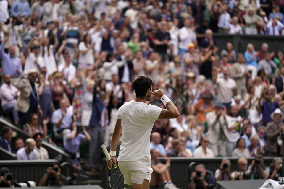 Spain's Carlos Alcaraz celebrates a point against Serbia's Novak Djokovic during the men's singles final on day fourteen of the Wimbledon tennis championships in London, Sunday, July 16, 2023. (AP Photo/Alberto Pezzali)