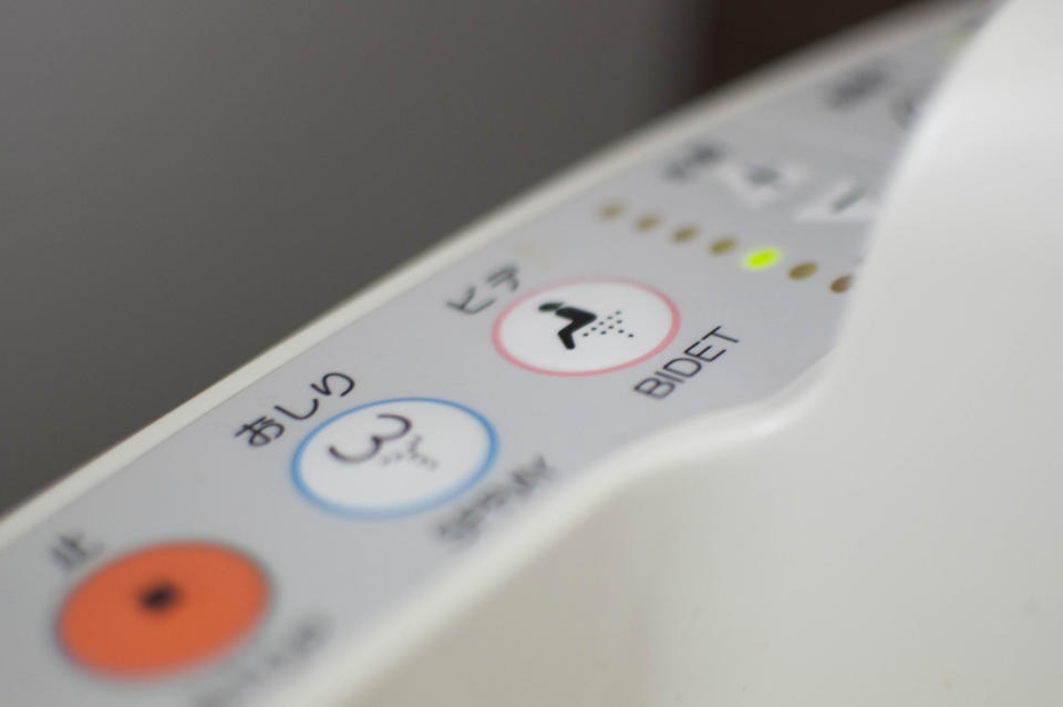 A bidet sign on a Japanese toilet