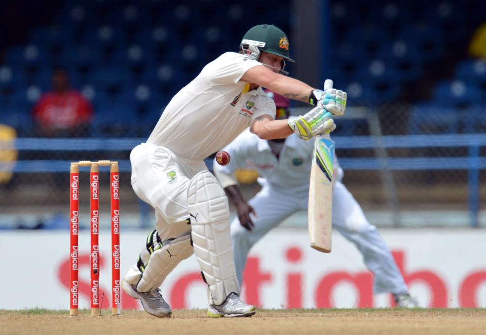 Australian batsman Matthew Wade plays a shot that will be caught out by Darren Bravo of the West Indies during the second day of the second-of-three Test matches between Australia and West Indies April 16, 2012 at Queen's Park Oval in Port of Spain. AFP PHOTO/Stan HONDA (Photo credit should read STAN HONDA/AFP/Getty Images)