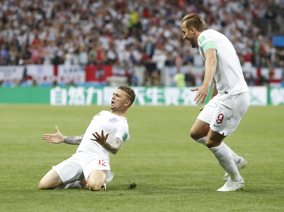 England’s Kieran Trippier, left, celebrates with Harry Kaneafter scoring the opening goal during the semifinal match between Croatia and England at the 2018 soccer World Cup in the Luzhniki Stadium in Moscow, Russia, Wednesday, July 11, 2018.(AP Photo/Alastair Grant)