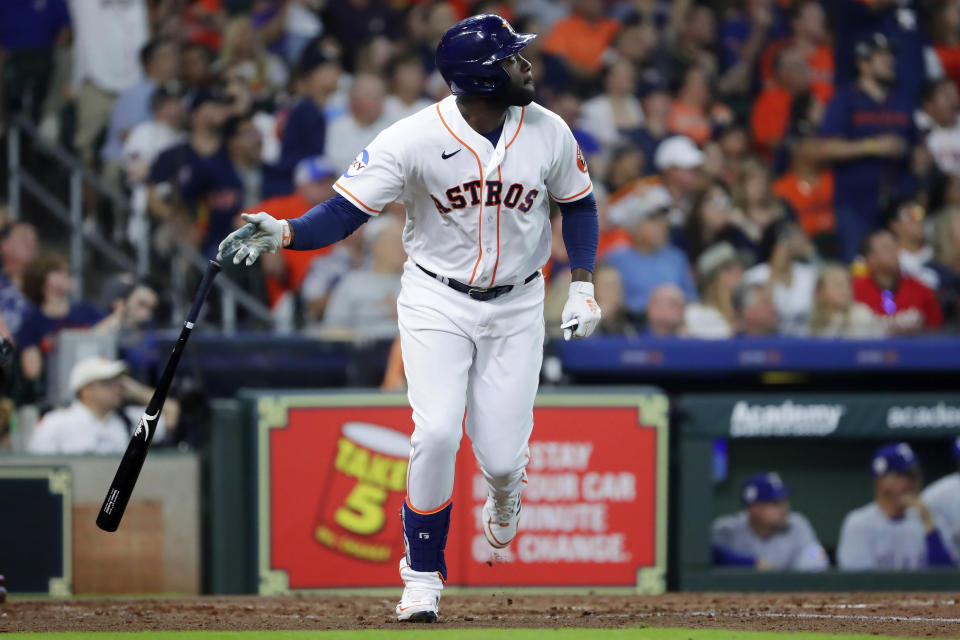 Houston Astros' Yordan Alvarez watches his two-run double against the Texas Rangers during the third inning of a baseball game Saturday, April 15, 2023, in Houston. (AP Photo/Michael Wyke)