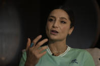 Nadia Nadim gestures as she speaks during an interview with The Associated Press in Doha, Qatar, Thursday, Dec. 1, 2022. Danish women's national team player Nadia Nadim was about to settle in for her job as a television commentator at the World Cup when she was shaken by tragic news: Her mother, who had helped the family flee the Taliban when Nadim was just a girl, had been hit by a car while rushing home to watch her daughter on TV. (AP Photo/Hassan Ammar)