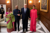 Indian President Ram Nath Kovind and his wife Savita Kovind stand with President Donald Trump and first lady Melania Trump as they arrive for a state banquet at Rashtrapati Bhavan, in New Delhi, India February 25, 2020. Alex Brandon/Pool via REUTERS