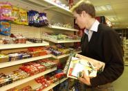 <p>Prince William had to shop like any other student, shown here browsing through the magazine rack in the Good News newsagents in St Andrews. (Anwar Hussein/allactiondigital.com)</p> 