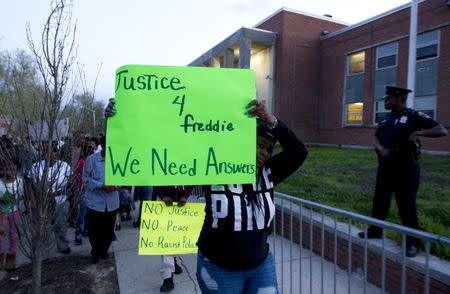 Demonstrators protest outside of the Baltimore Police Department's Western District police station during a rally for Freddie Gray, in Baltimore, April 21, 2015. REUTERS/Jose Luis Magana