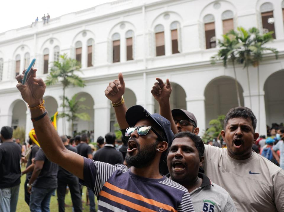 Demonstrators protest inside the presidential palace after it was stormed on Saturday (REUTERS)