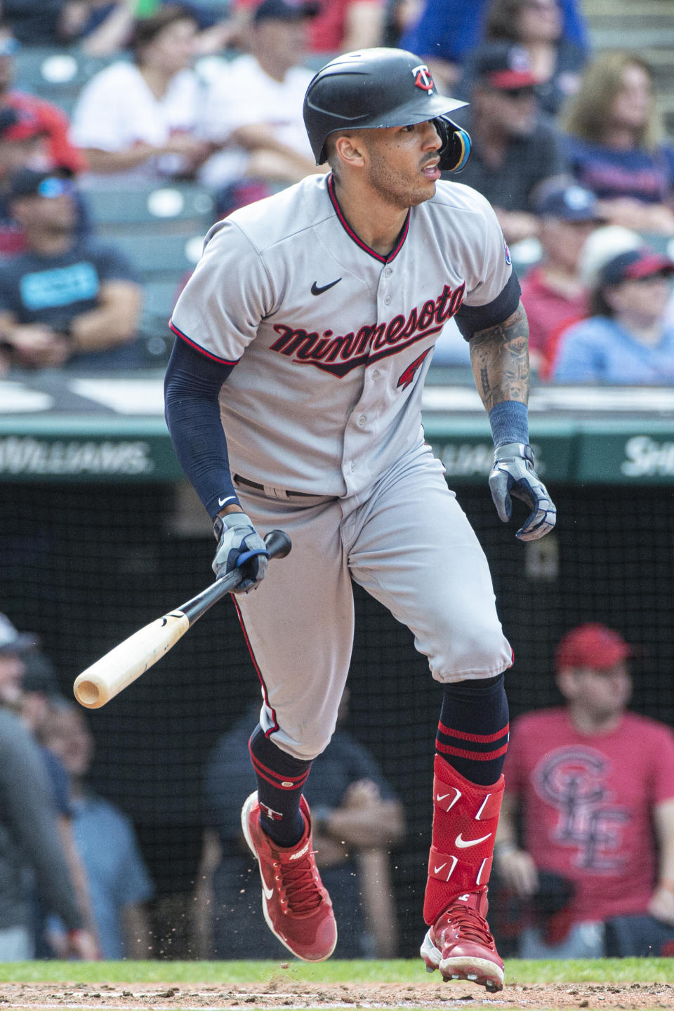 Minnesota Twins' Carlos Correa watches his single off Cleveland Guardians starting pitcher Eli Morgan during the eighth inning of a baseball game in Cleveland, Sunday, Sept. 18, 2022. (AP Photo/Phil Long)