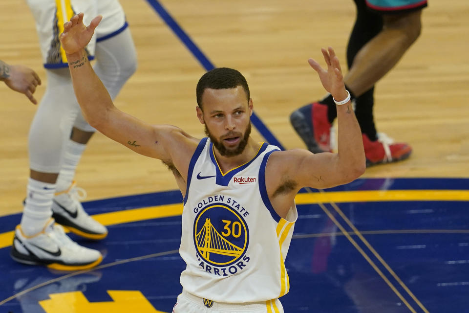 Golden State Warriors guard Stephen Curry (30) reacts after shooting a 3-point basket against the Memphis Grizzlies during the second half of an NBA basketball game in San Francisco, Sunday, May 16, 2021. (AP Photo/Jeff Chiu)