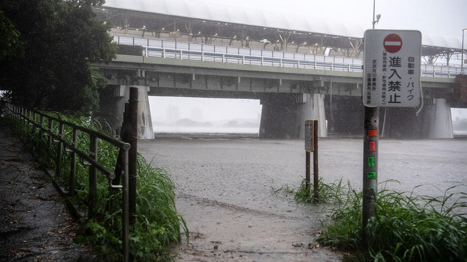 A footpath next to the Tama River is flooded during Typhoon Hagibis. (Photo by Carl Court/Getty Images)