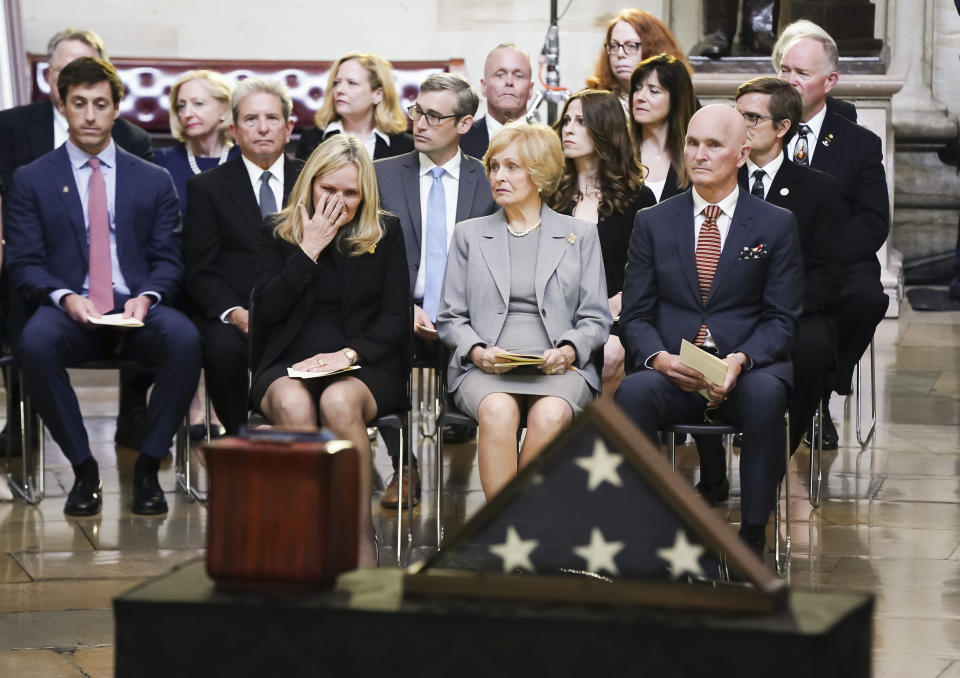 Jean Pucket, seated in foreground center, wife of retired Army Col. Ralph Puckett Jr., the last surviving Medal of Honor recipient for acts performed during the Korean War, sits with her children, Martha Puckett, left, and Thomas Puckett, right, during a ceremony where Puckett Jr.'s remains lie in honor in the Rotunda at the Capitol in Washington, Monday, April 29, 2024. Puckett Jr. died on April 8 at his home in Columbus, Ga., at the age of 97. (Shawn Thew, Pool Photo via AP)